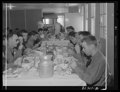 Untitled photo, possibly related to: "Like real home-cooked chicken" say these Craig Field flying cadets, in praise of the tender FSA (Farm Security Administration) "Food for Defense" chickens. Craig Field, Southeastern Air Training Center, Selma, Alabama