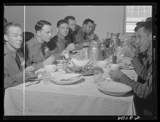 "Like real home-cooked chicken" say these Craig Field flying cadets, in praise of the tender FSA (Farm Security Administration) "Food for Defense" chickens. Craig Field, Southeastern Air Training Center, Selma, Alabama