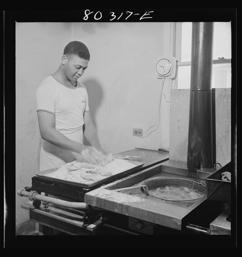 Craig Field cooks worked all morning preparing a feast of FSA (Farm Security Administration) "Food for Defense" chickens for the Craig Field training center for flying cadets. Selma, Alabama