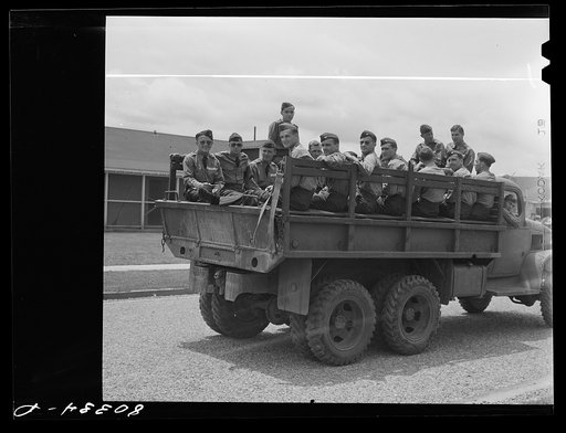 Untitled photo, possibly related to: Cadets ready to leave for the flying field after a satisfying meal of chicken. Craig Field, Southeastern Air Training Center. Selma, Alabama