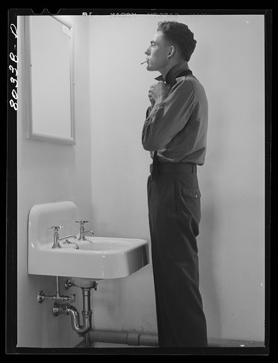 Untitled photo, possibly related to: Craig Field, Southeastern Training Center.Cadet dressing for Sunday dinner. Selma, Alabama