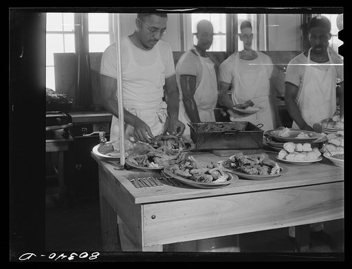 Untitled photo, possibly related to: Craig Field cooks setting out plates for chicken dinner. Craig Field, Southeastern Air Training Center, Alabama