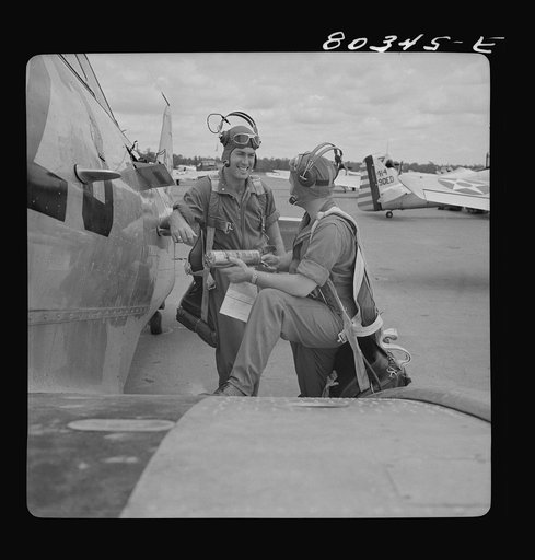 Flight instructors McTaggart and Gumison talk things over. Craig Field, Southeastern Air Force Training Center, Alabama
