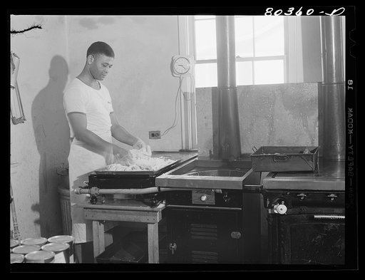 Untitled photo, possibly related to: Craig Field cooks worked all morning preparing a feast of FSA (Farm Security Administration) "Food for Defense" chickens for the Craig Field training center for flying cadets. Selma, Alabama