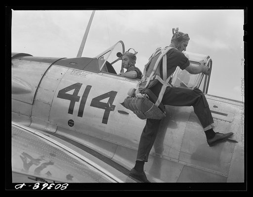 Untitled photo, possibly related to: Cadet mounting plane prior to training flight. Craig Field, Southeastern Air Training Center, Selma, Alabama