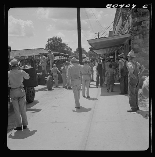 It's good to put your feet down on your own home street. Home guard passes through Enterprise, Coffee County, Alabama
