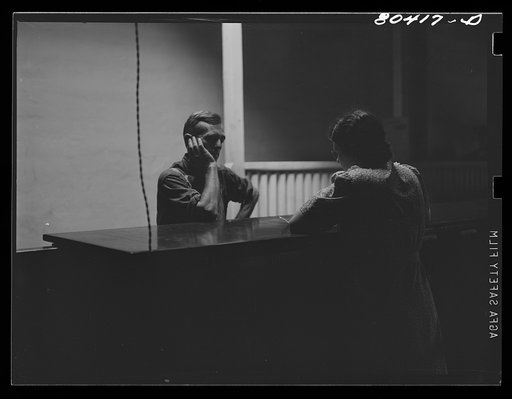FSA (Farm Security Administration) borrower reporting to clerk in Enterprise FSA office. Coffee County, Alabama
