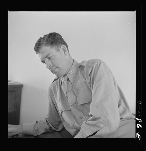 Untitled photo, possibly related to: Flight instructior McTaggart after a hearty meal of chickens raised by FSA (Farm Security Administration) borrowers. Craig Field, Southeastern Air Training Center. Selma, Alabama