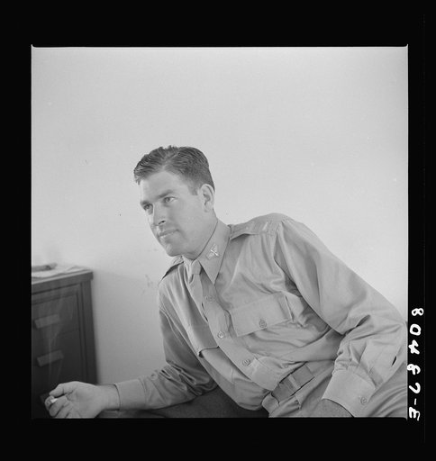 Flight instructior McTaggart after a hearty  meal of chickens raised by FSA (Farm Security Administration) borrowers. Craig Field, Southeastern Air Training Center. Selma, Alabama