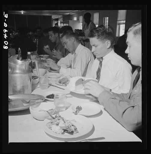 There's hardly room for cake after dinner of chickens raised by FSA (Farm Security Administration) borrowers. Craig Field, Southeastern Air Training Center, Selma, Alabama
