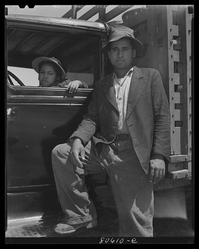 This trucker has been waiting all day to deliver his tomatoes to the Phillips Packing Company. Cambridge, Maryland