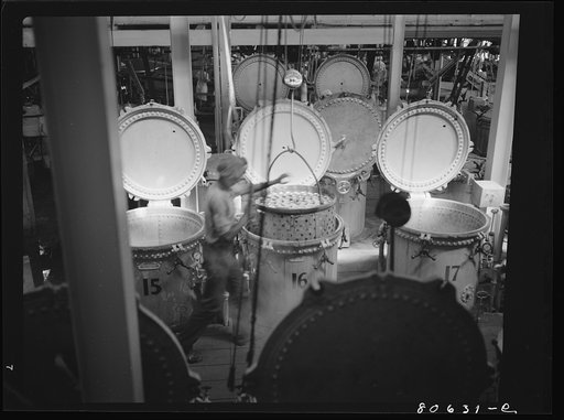 Untitled photo, possibly related to: Vegetables are cooked after canning in these compressed steam vats. Phillips Cannery, Cambridge, Maryland