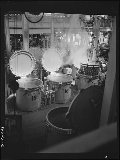 Untitled photo, possibly related to: Vegetables are cooked after canning in these compressed steam vats. Phillips Cannery, Cambridge, Maryland