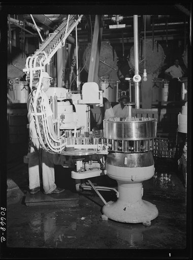 Untitled photo, possibly related to: Filling cans with tomato juice. Phillips Packing Company, Cambridge, Maryland