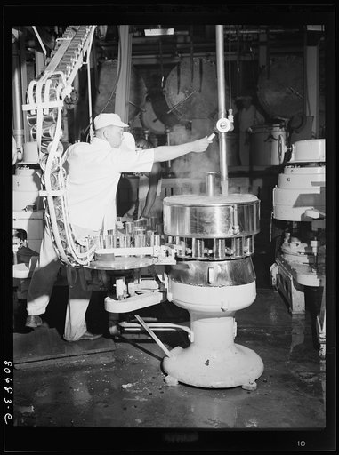 Untitled photo, possibly related to: Filling cans with tomato juice. Phillips Packing Company, Cambridge, Maryland