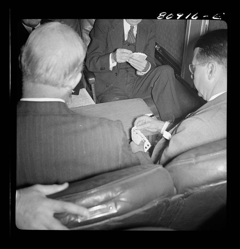 Untitled photo, possibly related to: Commuters playing bridge on train to New York City