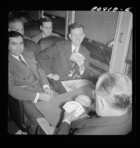 Untitled photo, possibly related to: Commuters playing bridge on train to New York City