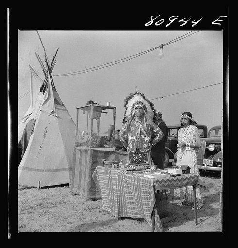 This Woods Indian had a busy day selling popcorn and birch bark novelties. Local Indian association-sponsored Indian fair. Windsor Locks, Connecticut