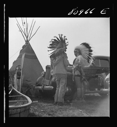 Windsor Locks, Connecticut. Two Indians standing by their car on the ground of the Indian fair sponsored by the local Indian association