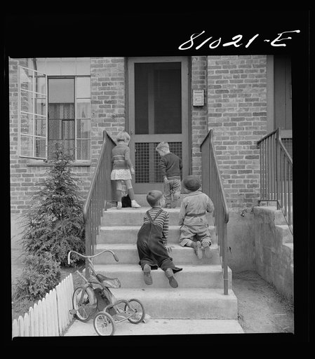 Children play in safety in the FHA (Federal Housing Administration) low income housing project at Holyoke, Massachusetts