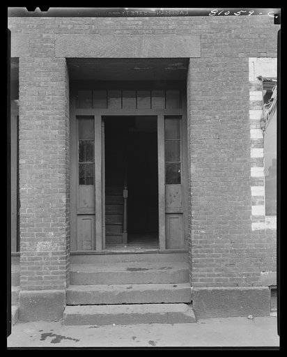 Generations of feet have trodden this worker's doorway. Holyoke, Massachusetts