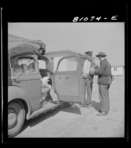 Untitled photo, possibly related to: Between shifts at defense plant this FSA (Farm Security Administration) tenant moves into FSA defense housing project. At Hartford, Connecticut