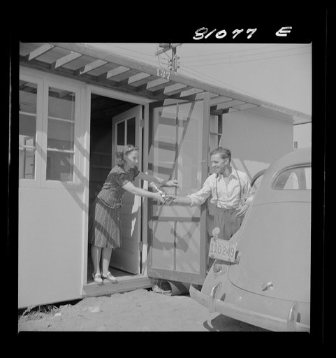 Untitled photo, possibly related to: Between shifts at defense plant this FSA (Farm Security Administration) tenant moves into FSA defense housing project. At Hartford, Connecticut