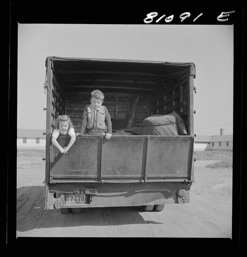 Untitled photo, possibly related to: Children on a tomato picker's truck in Maryland