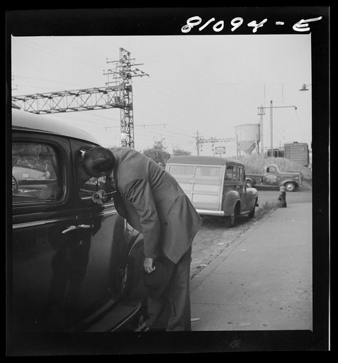 Westport, Connecticut. Commuter kissing his wife before catching train for New York
