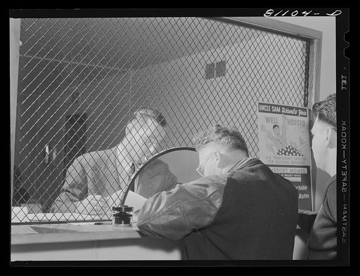 Defense worker signing up for houses in the office of the FSA (Farm Security Administration) defense housing project at Hartford, Connecticut