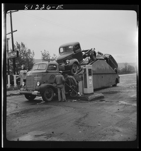 Car transport filling up with gas at Little Falls, New York