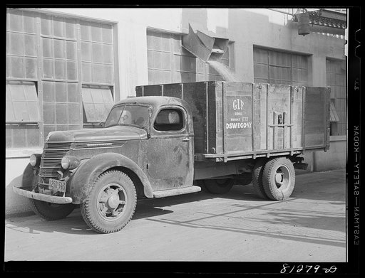 Truck loading with grain. Oswego grain elevator, New York