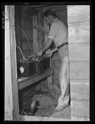 Automobile batteries furnish power storage for thirty-two volt wind charger. Savoy Mountains, Massachusetts