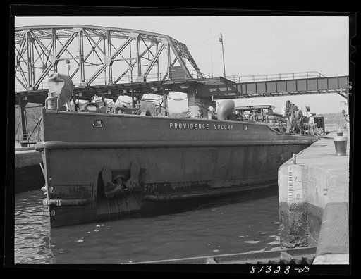 Untitled photo, possibly related to: Oil carrier settles in lock as the flood gates are opened. Amsterdam, New York