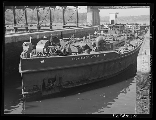 Oil carrier settles in lock as the flood gates are opened. Amsterdam, New York