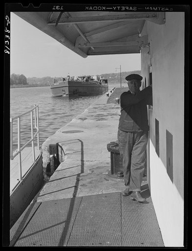 Lock hand opens lock gates by electric controls. Lock Eleven, Amsterdam, New York