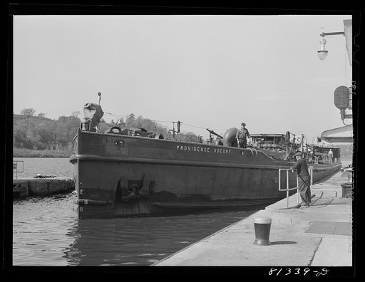 Oil carrier settles in lock as the flood gates are opened. Amsterdam, New York