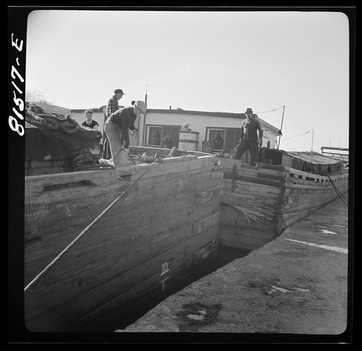 Barges being pulled through by winch, prior to picking towline from tug. Erie Canal, New York