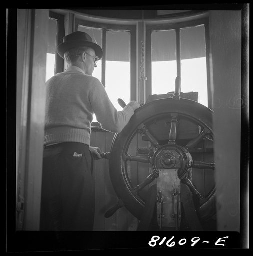 Untitled photo, possibly related to: Pilot on Hudson River ferry between Hudson and Athens, New York