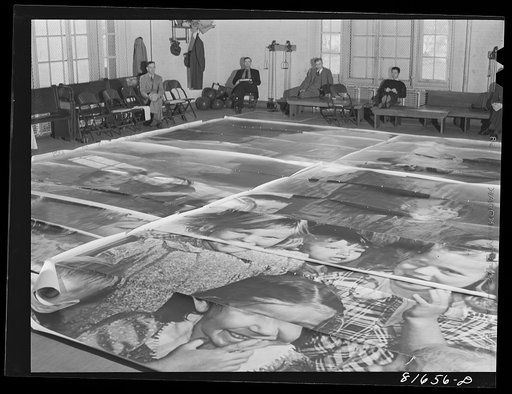 Untitled photo, possibly related to: Washington, D.C. Preparing the defense bond sales photomural, to be installed in the Grand Central terminal, New York, in the visual unit of the FSA (Farm Security Administration). Laying out finished prints for inspection