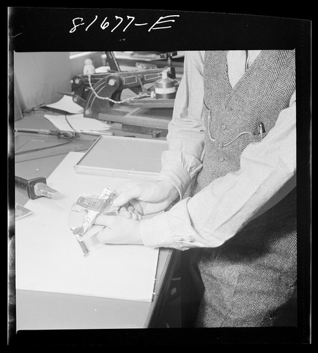 Washington, D.C. Tinsley preparing the defense bonds sales photomural for Grand Central terminal, New York