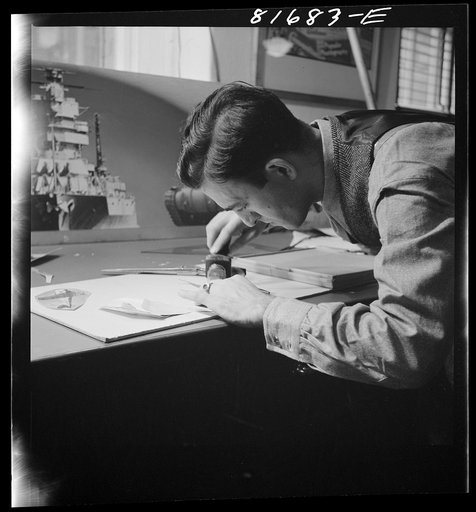 Untitled photo, possibly related to: Washington, D.C. Preparing the defense bonds sales photomural, to be installed in the Grand Central terminal, New York, in the visual unit of the FSA (Farm Security Administration). Milton Tinsley mounting parts of the dummy