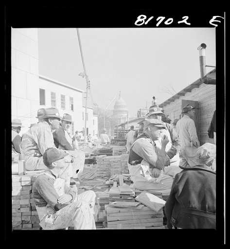 Washington, D.C. Workmen having lunch at a construction job undertaken to create emergency office space