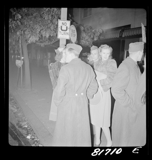 Servicemen waiting for bus at 11:00 p.m. Washington, D.C.