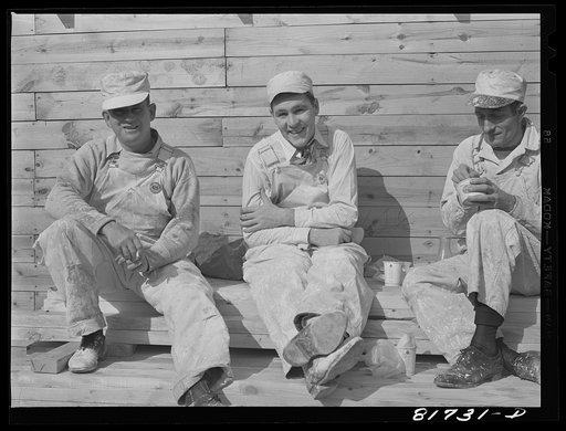 Untitled photo, possibly related to: Painters working on emergency defense office space job taking time out for lunch. Washington, D.C.
