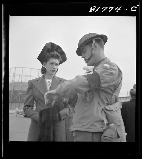 Untitled photo, possibly related to: Army sentries standing guard at transport dock one day after the Japanese attack on Pearl Harbor. San Francisco, California