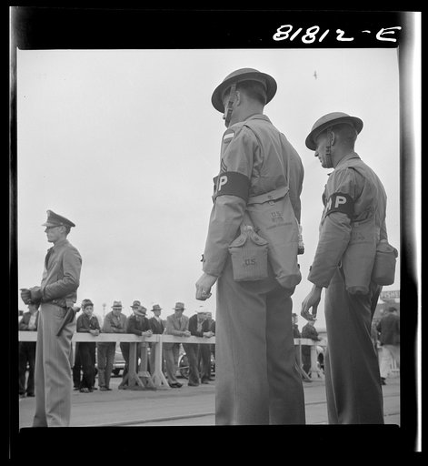 Untitled photo, possibly related to: Sentry on guard at the Army transport dock. San Francisco, California