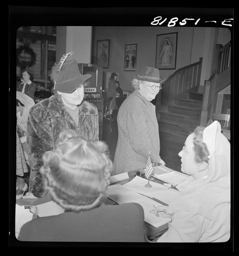 Untitled photo, possibly related to: Signing up for Red Cross duties. Red Cross headquarters. San Francisco, California