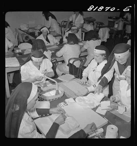 Wrapping bandages. Red Cross headquarters. San Francisco, California