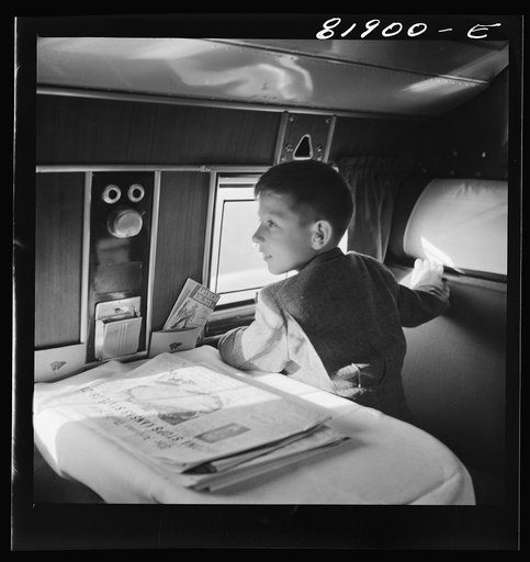 Untitled photo, possibly related to: Passengers aboard an American airliner enroute from Washington to Los Angeles